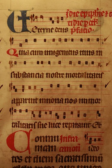handwritten sheet music on parchment