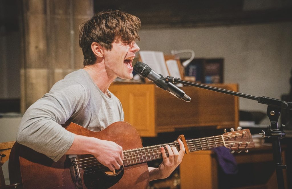 man singing sing songs